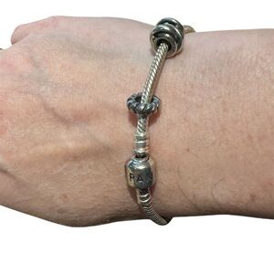Elegant Silver Bracelet with two charms included, by Pandora